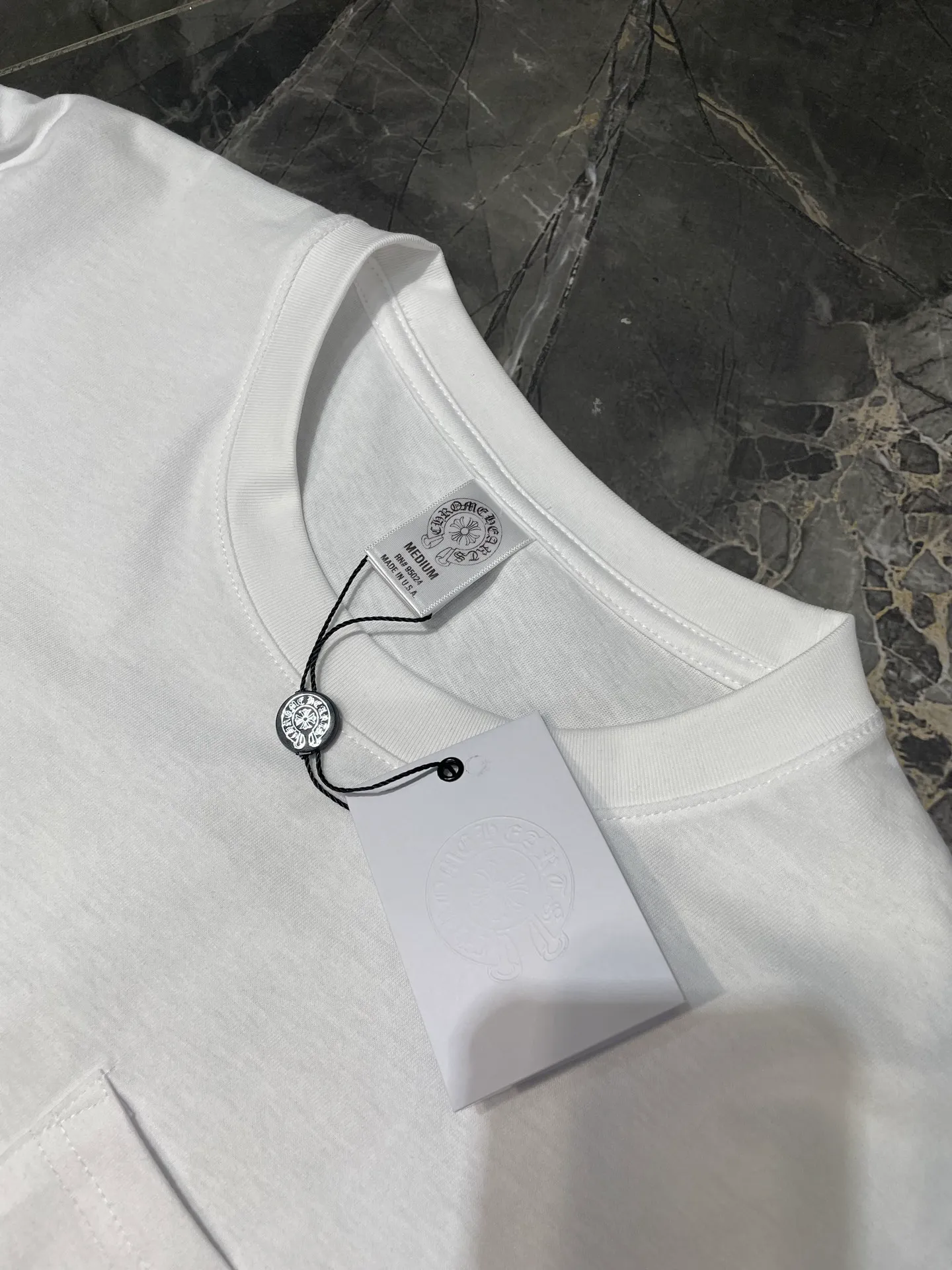 P250 N502 Kl 🌟【Top original order】Chrome Hearts Sanskrit short sleeves printed all over the back. Process description: The fabric is made of 26-woven 200g cotton, and the printing is made of special imported slurry. The overall routing is straight and delicate, the fabric is comfortable and soft, and the color is consistent without color difference. It can be matched with the same style to create a fashionable look and control various occasions. Customized accessories, complete three standards, same style for men and women!  size：s m l